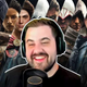 An image shows Dan Allen Gaming sitting in front of several Assassin's Creed protagonists.